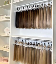 there are many different types of hair on the shelves in this store, including blondes and dark brown