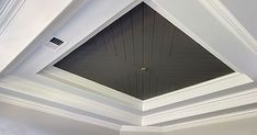 the ceiling in this room is painted black and white