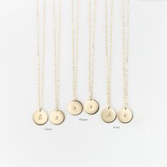 "Personalized Gold, Silver or Rose Gold Circle Necklace. Add a custom initial to the disk or leave it blank. This classic disk necklace will be your new everyday favorite! THE MEDIUM DISK NECKLACE D E T A I L S * 100% highest-quality 14K gold fill, Sterling Silver or Rose Gold Filled * Made to order at the length you choose * 13mm disk with a smooth, satin finish * Optional, hand-stamped personalization - - GOLD = 14k gold filled - - SILVER = sterling silver - - ROSE = rose gold filled To Add an Custom Pendant Necklace, Disk Necklace, Rose Gold Circle, Initial Disc Necklace, Gold Circle Necklace, Moon Phases Necklace, Custom Pendants, Custom Initials, Disc Necklace