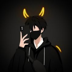 a man wearing a black hoodie with horns on his head is holding a cell phone