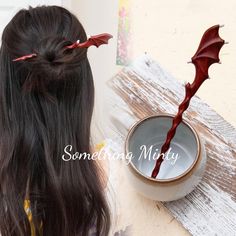 Unleash your inner dragon with our Handmade Dragon Design Wood Hair Stick. This exquisite piece, carefully crafted from high-quality wood, showcases a stunning dragon design that embodies strength, elegance, and mystique.  ❤️Dragon Wing Design Wood Hair Stick *The hair pin is about 8 inch long. *Perfect for all hair types. *This listing is for one hair stick. *Material: Paduak-robust reddish-brown with varying contrast *Need help with using a hair pin? Tutorial linked below https://www.youtube.com/shorts/WF4k95Zj7yU 🌟Highlights: *Made from high quality wood and fine carved. *Nice color that goes with everything in your closet *A perfect gift for birthdays, anniversaries, bridesmaids, graduation, friendship, and sisters. 🛍️Service: *We strive for customer satisfaction! If you have any que Dragon Hair Pin, Hair Pin Tutorial, Pin Tutorial, Wood Hair Pin, Dragon Hair, Character Accessories, Dragon Wing, Stick Wood, Xmas Wishlist