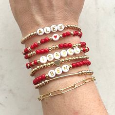 🔹 Design the custom name beaded bracelet that your Valentine has always wanted! These stacking mama bracelets can be personalized so you can get exactly what you want! 🔹They are made with 4mm red jade beads, 18k gold plated beads, 18k gold filled beads, sterling silver beads or rose gold beads and then strung together with a strong double-strung elastic cord. 🔹Please add each bracelet style separately to your cart. They will be sent to you as a stack. If you want all seven bracelets, please choose the option for all eight bracelets, otherwise you will receive the single styles that you purchased. 🔹Each custom beaded bracelet stack is packed in an organza bag and a handwritten message can also be included. It makes the perfect Valentine's Day gift for yourself, your mom, a new mom or an Kids Name Bracelet, Mama Bracelet, Red Jade, Rose Gold Beads, Bracelet Style, Personalized Gifts For Mom, Making Things, Letter Beads, Copper Bracelet