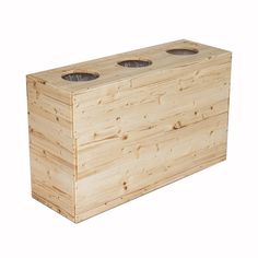 a wooden box with three holes in it