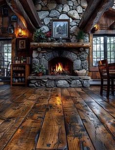 a living room filled with furniture and a fire place in the middle of a wooden floor