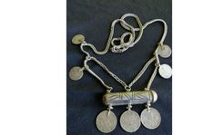 This antique amulet necklace is a work of excellent craftsmanship from the Ottoman period. Silver niello work and elegant silk chain make this necklace a unique and valuable addition to any collection. It is an original antique necklace from the 1800s, bearing his signature on Ottoman coins, contributing to its historical and cultural importance. It weighs 44 grams. Thank you for viewing my ad. All purchases you make from TURKEY are carefully packaged and shipped with tracking. If you need more Amulet Style Coin Pendant Necklace, Handmade Coin-shaped Amulet Necklace, Coin Pendant Medallion Necklace For Rituals, Traditional Medallion Necklace For Collectors, Medallion Necklace With Coin Pendant For Rituals, Handmade Amulet Coin Necklace, Medallion Necklaces With Coin Pendant For Rituals, Rituals Medallion Necklace With Coin Pendant, Traditional Handmade Coin Pendant Necklace