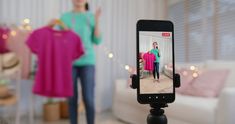 a woman taking a photo of herself in her living room