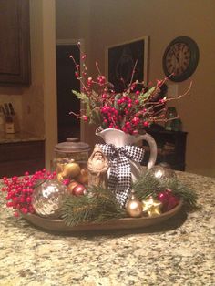 a tray with christmas decorations on top of a counter