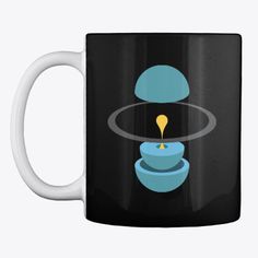 a black coffee mug with a blue and yellow object floating on it's side