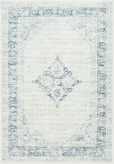 a blue and white rug with an ornate design