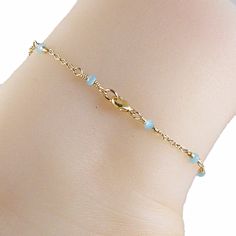 Dainty Blue Chalcedony Anklet Gorgeous blue bead gold chain anklet made with small blue chalcedony gemstones that are a lovely blue green shade, and 14k gold filled chain. The anklet has a 14k gold filled lobster clasp. Choose the size anklet you need from the drop-down menu, bearing in mind that the anklet should be approximately one inch larger than the size of your ankle. The anklet will arrive in an attractive gift box. Click here for this anklet with a sterling silver chain Blue Beaded Chain Anklets As Gift, Blue Beaded Chain Anklets For Gift, Blue Dainty Anklets For Gift, Gold Chain Anklet, Blue Anklet, Gold Anklet, Chain Anklet, Blue Chalcedony, Anklet Jewelry