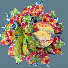 a colorful paper flower with a cake on it