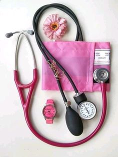 a stethoscope, watch and pink flower on a white surface