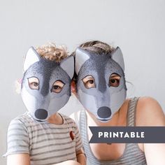 two people wearing animal masks with the words printable on them