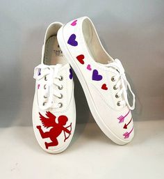 These are hand painted shoes for your Valentine. They are painted with high quality fabric paints, and sealed to protect the art. Painted on tie up white canvas shoes.TODDLER SIZESUS 7-11CHILD SIZESUS 12-6WOMENS SIZESUS 7-11 Hand Painted Canvas Shoes With Round Toe, Hand-painted Canvas Shoes With Round Toe, Hand Painted Round Toe Canvas Shoes, White Hand Painted Canvas Shoes With Round Toe, Hand Painted White Canvas Sneakers, Valentines Shoes, Painted Valentines, White Canvas Shoes, Girls Shoes Sneakers