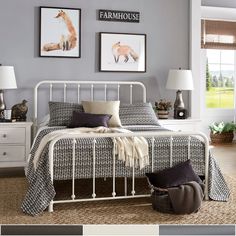 a bedroom with gray walls and white furniture