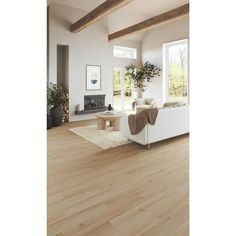 a living room filled with furniture and a fire place next to a window covered in plants