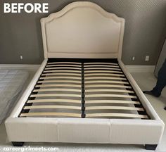 a bed that has been made and is in the process of being cleaned