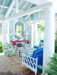 a living room with blue and white furniture