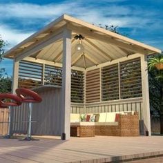 a gazebo sitting on top of a wooden deck