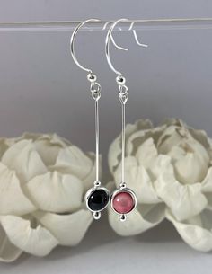 "\"Mismatched\" muted pink and black onyx/rhodonite and 925 sterling Orbits series minimalist drop earrings, with 6mm natural gemstone beads, each framed with a silver circlet. Earrings full length is about 2\", drop part 1.25\". The circlets spin freely, so these are your little fidget/spinner earring toys too. This is my first mismatched set - the shiny black of onyx goes so well with these lovely vibrant yet muted pink rhodonite beads, I had to bring them together for this new popular trend! Mismatched Earrings Trend, Feminine Symbols, Pink Rhodonite, Muted Pink, Garnet And Gold, Earring Trends, Mismatched Earrings, Fidget Spinner, Agate Pendant