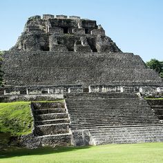 an ancient building with steps leading up to it's top and bottom level in the foreground