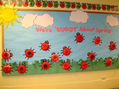 a bulletin board with ladybugs on it in a classroom setting at the elementary school