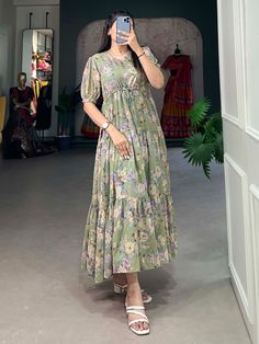 This pista green georgette frock dress with floral prints is a versatile and elegant addition to any wardrobe. Its timeless design, paired with the contemporary appeal of floral prints, makes it suitable for a wide range of occasions. 
This exquisite dress is crafted from premium georgette fabric, offering a soft and flowing silhouette that enhances every body type. Available in sizes XS to L, this fully stitched frock dress ensures a perfect fit, combining comfort with style.
The pista gre Summer Green Floral Print Chiffon Dress, Frock Type Kurti Designs, Green Midi-length Chiffon Dress For Summer, Green Knee-length Chiffon Dress For Spring, Green Knee-length Chiffon Dress For Summer, Green Chiffon Dress For Garden Party, Green Knee-length Chiffon Summer Dress, Knee-length Green Chiffon Dress For Summer, Summer Green Knee-length Chiffon Dress