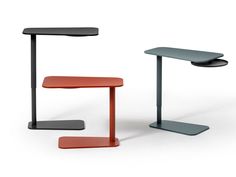 three different types of tables with one sitting on the floor and one standing on the ground