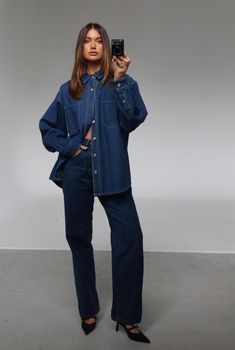 The Sana Shirt Blue by Nakedvice is an oversized denim shirt. Featuring pockets on the front chest and pleat detail at back, The Sana Shirt Blue is the perfect denim shirt. Pair with The Sana Skirt Blue for a complete look. 

Eden wears a size S and is 174cm tall. 
 Size: XS, S, M, L, XL, XXL; Colour: BLUE Cheap Trendy Denim Blue Shirt, Front Button Down Jeans, Affordable Boyfriend Fit Denim Blue Shirt, Affordable Trendy Denim Blue Shirt, Affordable Washed Blue Button-up Jeans, Cheap Oversized Denim Top For Fall, Maxi Shirt Denim, Cheap Everyday Denim Blue Shirt, Casual T-shirt For College