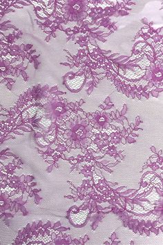 purple lace fabric with flowers on it