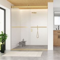 a bathroom with a shower, toilet and sink in it's center wall is shown