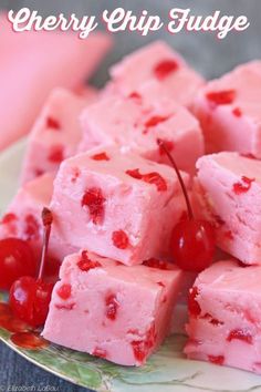 cherry chip fudge cake on a plate with cherries around it and text overlay that reads cherry chip fudge