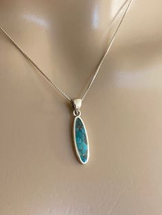 Small Sterling Silver Oval Turquoise Necklace  Minimalist and Dainty Necklace  December Birthstone Necklace  Metal: All components are made from solid  .925 Sterling Silver Stone: Genuine Turquoise Gemstone  Measurement: pendant height is approx. 31mm including bail and 7mm wide  Choose Chain Length at checkout  You can find other gemstone jewelry in my shop here  https://www.etsy.com/shop/LinksAndStones?ref=seller-platform-mcnav&section_id=24295773 Please feel free to Convo me with any question Oval Turquoise Natural Stone Necklaces, Turquoise Oval Natural Stones Necklaces, Oval Turquoise Necklaces With Natural Stones, Turquoise Oval Necklaces With Natural Stones, Turquoise Necklaces With Oval Natural Stones, Handmade Turquoise Necklace With Oval Pendant, Oval Turquoise Necklace With Natural Stones For Gift, Blue Oval Turquoise Necklace With Natural Stones, Turquoise Oval Cabochon Necklace Gift