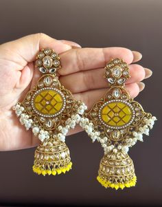 Statement earrings for a statement look! These handmade high quality kundan polki and meenakari earrings in stunning yellow and gold are a unique addition to your outfit to glam it up! These can be paired with both Indian and western outfits. They are also extremely lightweight because they are handcrafted. Easy on your ears and beautiful for the eyes 💖 For any queries, please reach out to us. Happy shopping! Diwali Jewellery, Meenakari Earrings, Pakistani Wedding, Western Outfits, Diwali, Statement Earrings, Jewelry Earrings Dangle, Dangle Drop Earrings, Happy Shopping