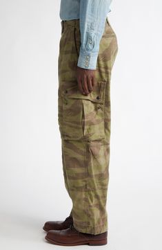 Washed and faded like a pair of old favorites, these cargo pants made of soft cotton feature a pale camo pattern and plenty of pockets for stowing essentials. 18 1/2" leg opening; 12" front rise; 17" back rise Zip fly with button closure Front slant pockets; coin pocket; back pockets; cargo flap-patch pockets Drawstring hems 100% cotton Machine wash, tumble dry Imported Designer Clothing Combat Style Cotton Cargo Jeans With Patch Pockets, Camouflage Straight Leg Parachute Pants With Side Pockets, Khaki Military Cargo Jeans With Flap Pockets, Camouflage Tapered Leg Pants With Cargo Pockets, Outdoor Camouflage Cargo Pants With Patch Pockets, Camouflage Straight Leg Bottoms With Patch Pockets, Camouflage Cotton Cargo Parachute Pants, Camouflage Straight Leg Parachute Pants With Cargo Pockets, Camouflage Cargo Pants With Tapered Leg