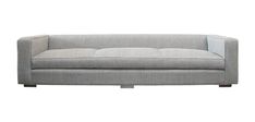 a gray couch with two pillows on it's back and the seat upholstered