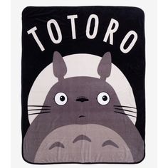 the totoro blanket is black and has an image of a cartoon character on it