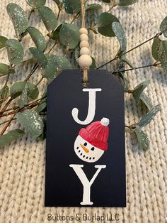 a christmas ornament with a snowman on it