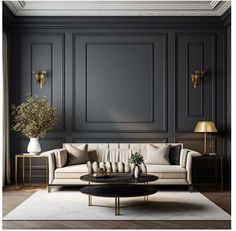 an elegant living room with black walls and white couches, coffee table and lamp