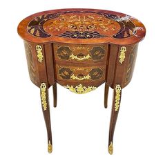 an ornately decorated table with two drawers