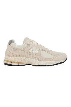 New Balance: Beige & Off-White 2002R Sneakers | SSENSE Neutral Lace-up Sneakers With Rubber Sole, Casual Neutral Sneakers With Rubber Sole, New Balance Cream Sneakers With Contrast Sole, Cream Sneakers With Boost Midsole For Spring, Cream Low-top Sneakers For Jogging, Sporty Neutral Sneakers For Spring, Cream Suede Sneakers For Streetwear, Beige Mesh Sneakers With Boost Midsole, Beige Running Shoes With Boost Midsole For Jogging