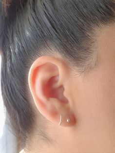 This Dainty Spiral Twist Earrings for Single Pierced Ears is very comfy and lightweight, perfect for every day wear and you only need 1 piercing hole in your ear to wear it!! It will look like if you are wearing 2 earrings: 1 Ball stud and 1 Hoop. QUANTITY: 1pair. MEASUREMENTS:  Diameter 7- 8 mm        Thickness - 20 gauge, standard post size MATERIALS: Solid Sterling Silver FEATURES: * Water and Tarnish resistant, shower safe. * Nickel & Lead Free (Hypoallergenic) Safe for sensitive skin. * Made of 100% Top quality USA materials. PACKAGING: Your new jewelry ships nicely wrapped in a jewelry gift box, ready for gift giving! ◇ At Sparkling Hearts Designs we love our clients and our planet, that's why our packaging is not just beautiful but is also made from recycled or reusable materials. ◇ Fake Ear Piercings, Twist Earrings, Fake Earrings, Spiral Earrings, Minimal Jewelry, Cartilage Piercing, Single Earring, Dainty Earrings, Jewelry Earrings Hoops