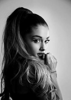 a black and white photo of a woman with long hair