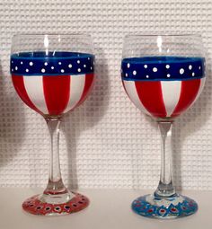 two wine glasses with red, white and blue designs