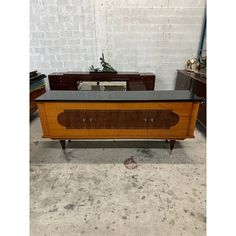 a very nice looking table with some sort of furniture on it's sideboard