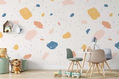 a child's room with colorful paint splattered on the wall