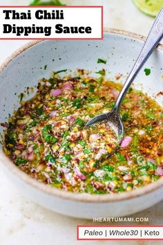 thai dipping sauce in a white bowl with a spoon on the side and text overlay that reads, thai dipping sauce