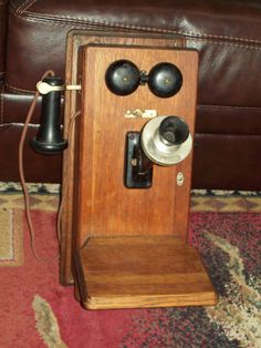 an old fashioned phone is sitting on the floor