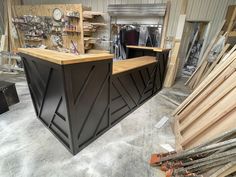 a counter in a shop with lots of wood