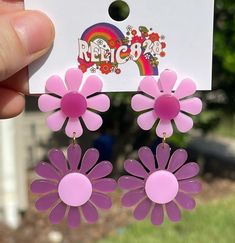 Step into the vibrant world of the 1960s with these 60s Pink and Purple Mod Flower Earrings. Inspired by the mod fashion of the era, these earrings feature a delightful combination of pink and purple hues in a bold flower design. Crafted from super lightweight acrylic, these earrings offer comfort without compromising on style. The posts are made of stainless steel, coated in 18k gold for a touch of elegance, and are nickel-free for a comfortable wearing experience. Product Details: Design: The Affordable Purple Retro Earrings, Trendy Pink Flower Earrings, Trendy Pink Flower Earrings For Summer, Pink Fun Spring Jewelry, Fun Pink Spring Jewelry, Spring Pink Fun Jewelry, Trendy Purple Earrings For Spring, Retro Pink Party Earrings, Purple Flower Earrings For Spring Party